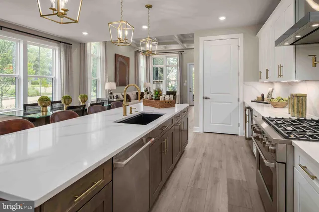 a kitchen with sink stove and refrigerator
