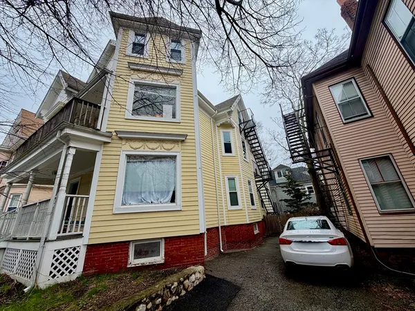 a car parked in front of a house