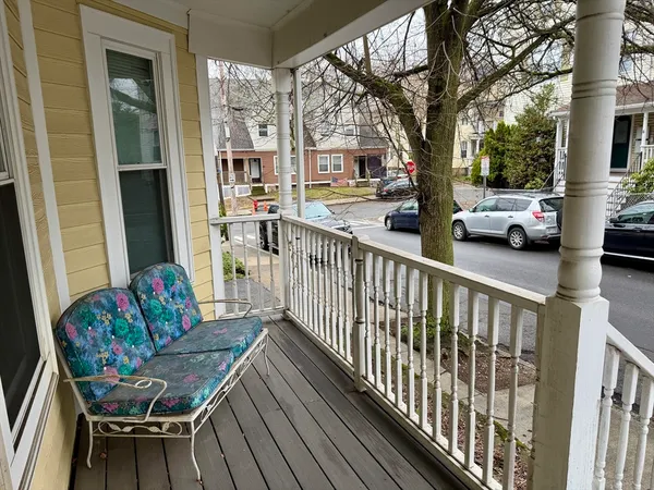 a view of balcony with furniture and trees