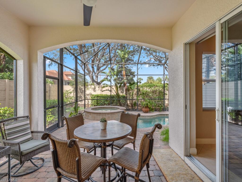 5705 Mango Circle Naples, FL 34110 - Photo 18 of 48 a view of a dining room with furniture and a window