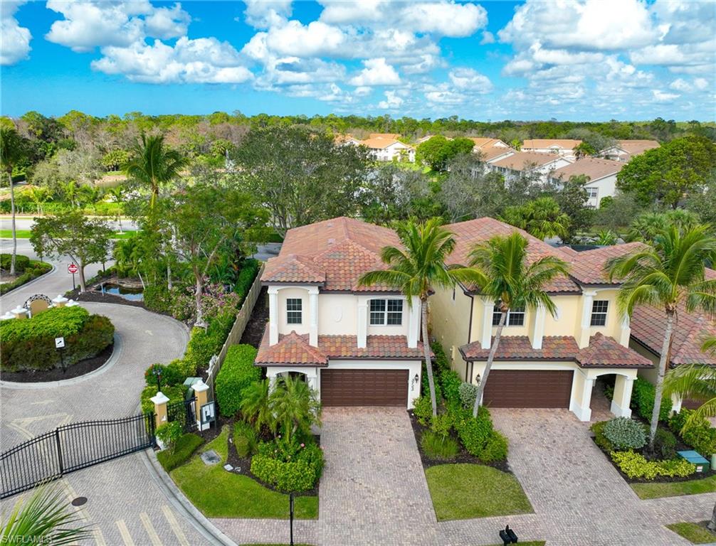 5705 Mango Circle Naples, FL 34110 - Photo 22 of 48 a front view of a house with garden