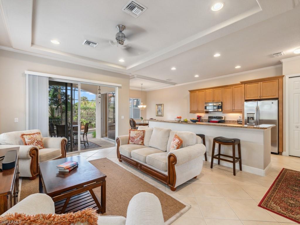 5705 Mango Circle Naples, FL 34110 - Photo 6 of 48 a living room with furniture and a large window