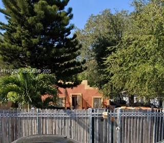 5426 Northwest 3rd Avenue Miami, FL 33127 - Photo 2 of 2 a view of a white house with a tree