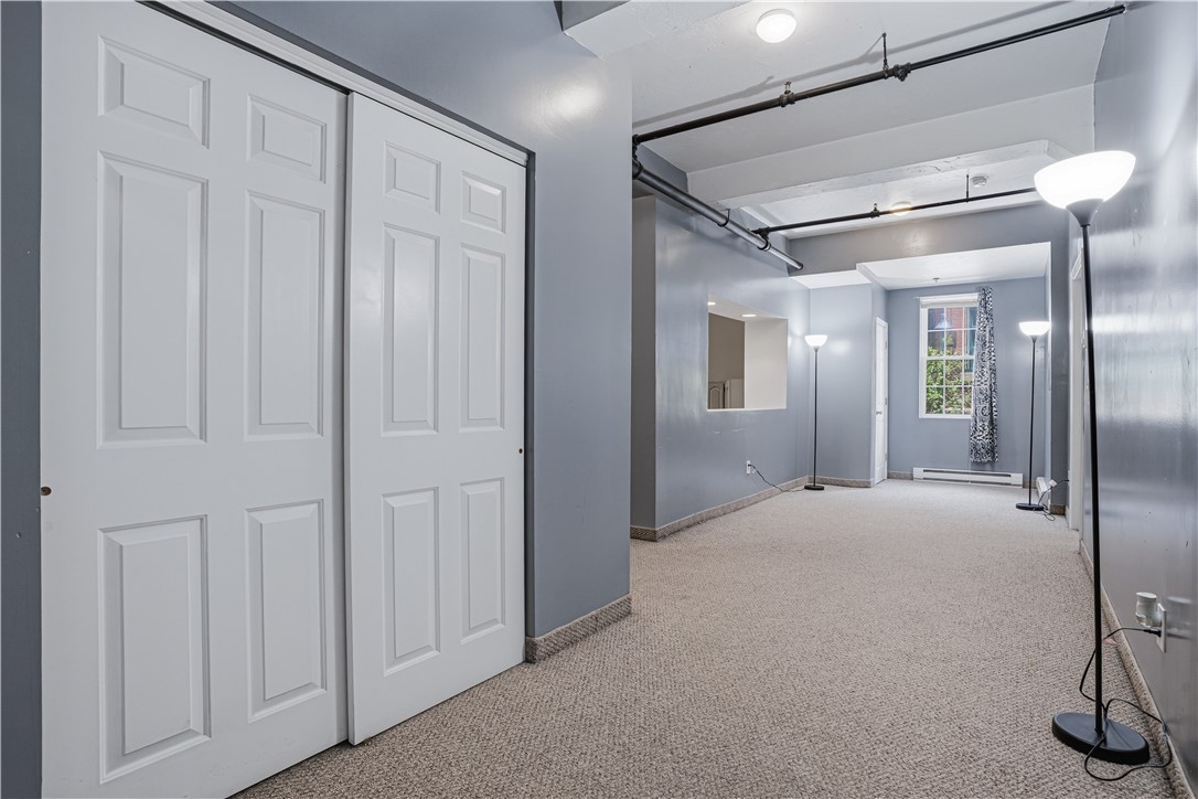 148 Bernon Street, Unit 7 Woonsocket, RI 02895 - Photo 22 of 49 Massive Hallway could be bonus play/office area