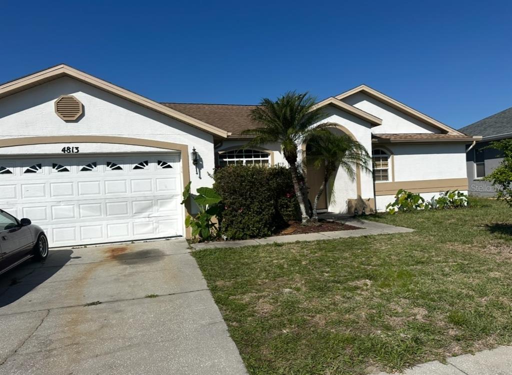 4813 Ft Peck Road New Port Richey, FL 34655 - Photo 1 of 1 a front view of a house with a yard