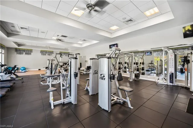an aerial view of a house with a yard and lake view