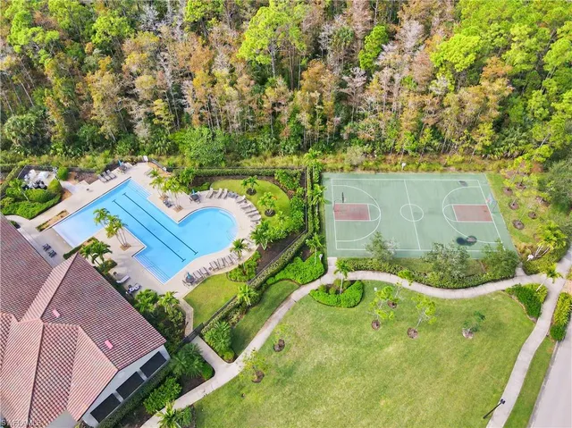 a view of a house with a garden and a yard