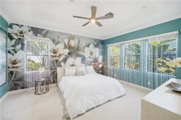 a bedroom with a bed and a cabinets