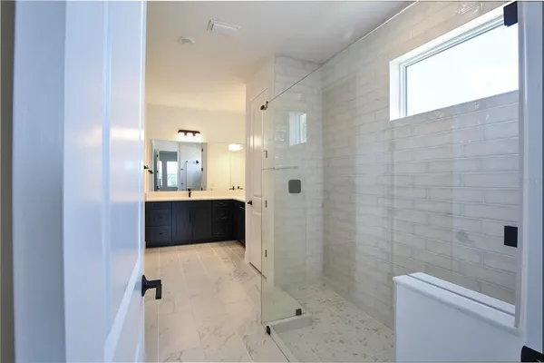 a bathroom with a double vanity sink mirror and double