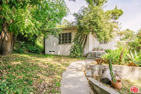 a house with trees in front of it