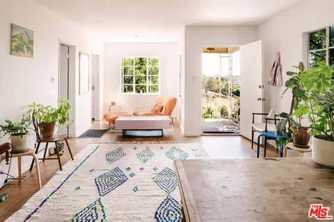 a bedroom with a bed furniture and a window