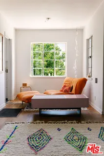 a kitchen with a window a sink and potted plant