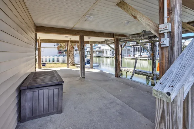 a view of a porch with wooden floor