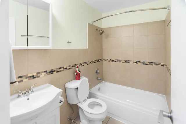 a bathroom with a sink a toilet and a bathtub