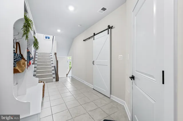a view of entryway with stairs and wooden floor