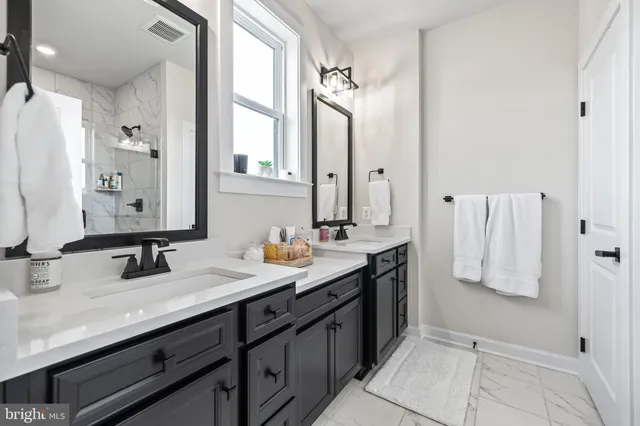 a living room with patio furniture and a fireplace
