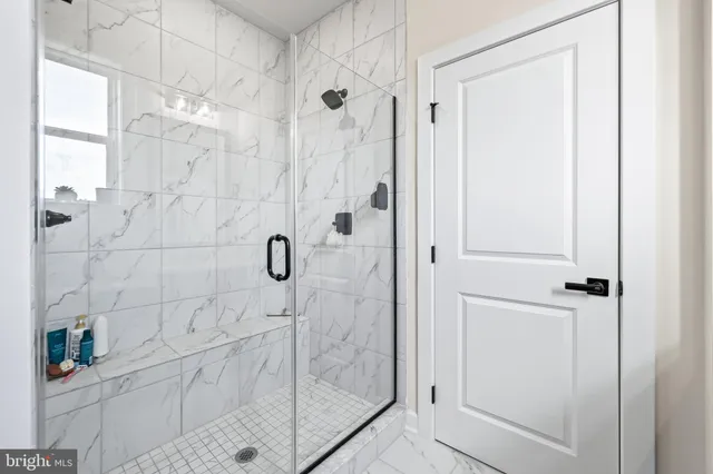 a living room with patio furniture and a large window