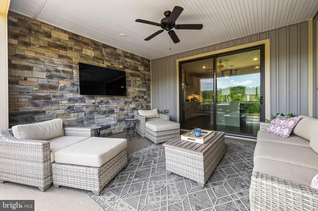 a view of a patio with table and chairs