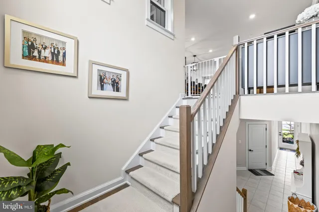 a dining room with stainless steel appliances furniture dining table and wooden floor