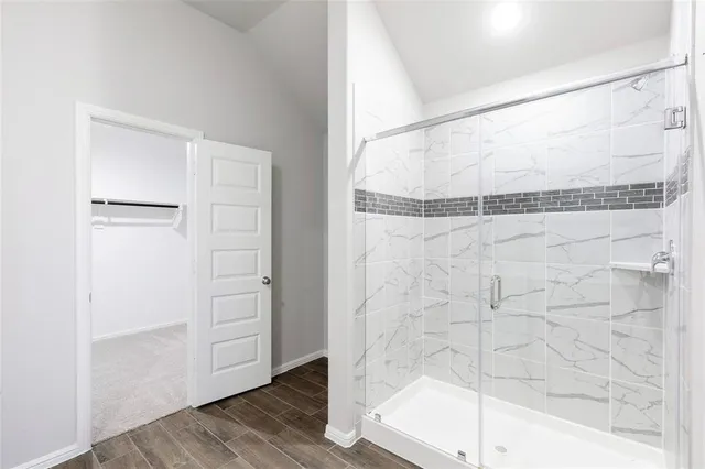 a bathroom with a double vanity sink toilet and mirror