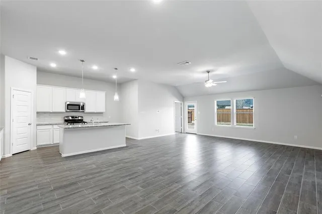 an aerial view of a house with a swimming pool