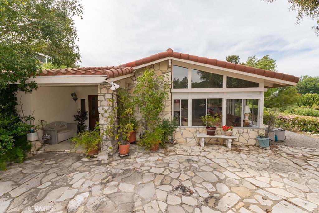 5224 Middlecrest Road Rancho Palos Verdes, CA 90275 - Photo 1 of 1 a front view of a house with garden