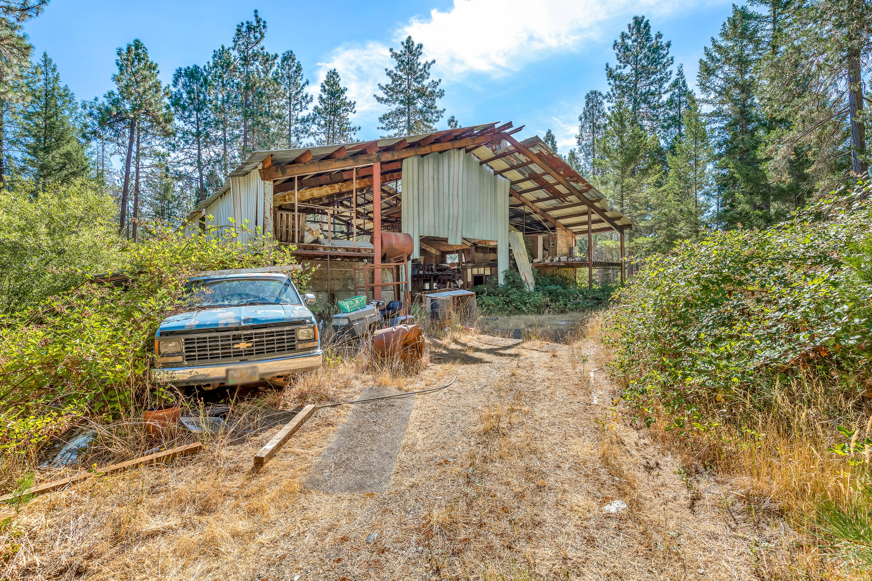9184 West Evans Creek Road Rogue River, OR 97537 - Photo 17 of 29 a view of a small house with backyard