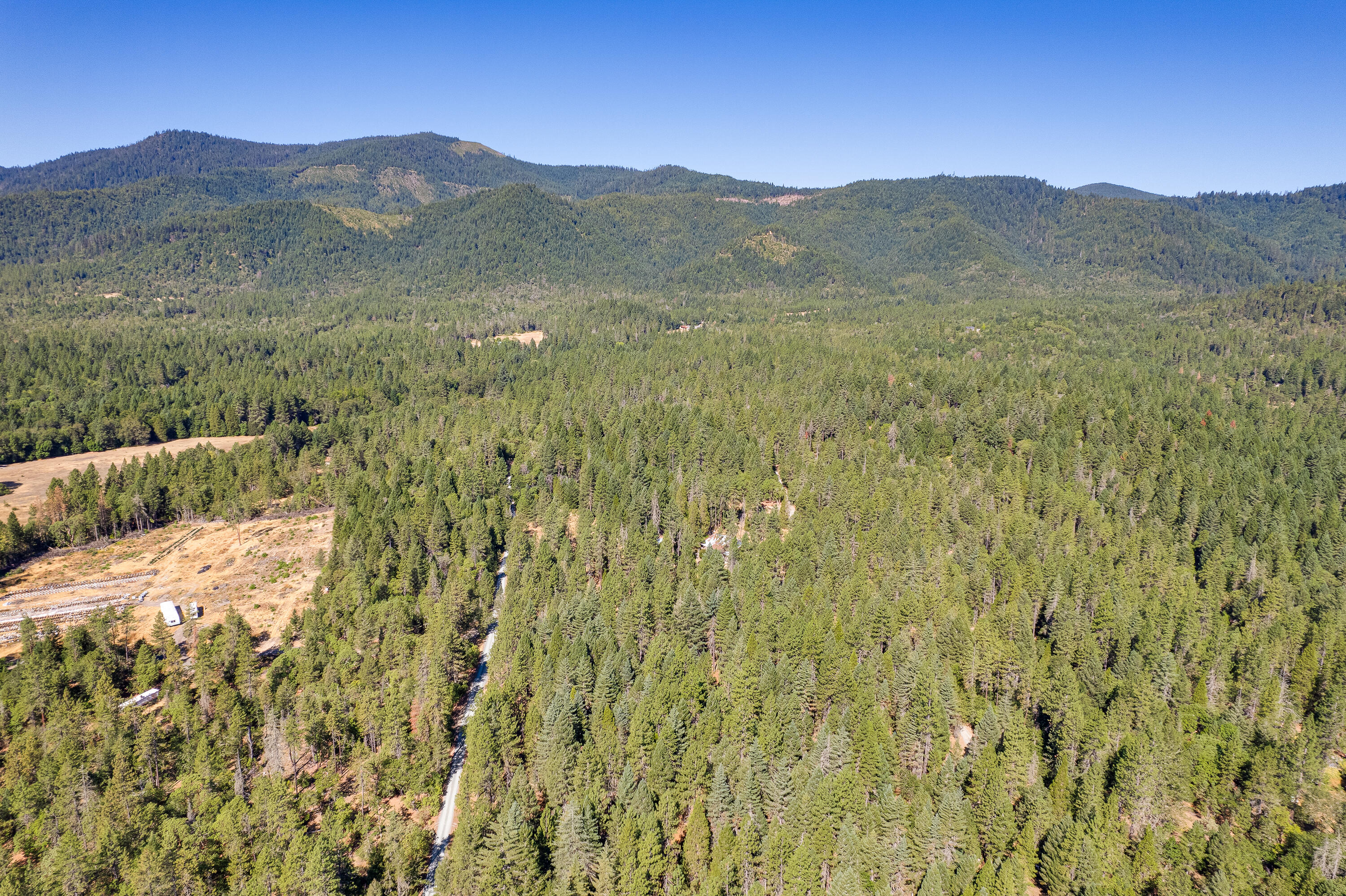 9184 West Evans Creek Road Rogue River, OR 97537 - Photo 9 of 29 a view of a lush green hillside and a mountain