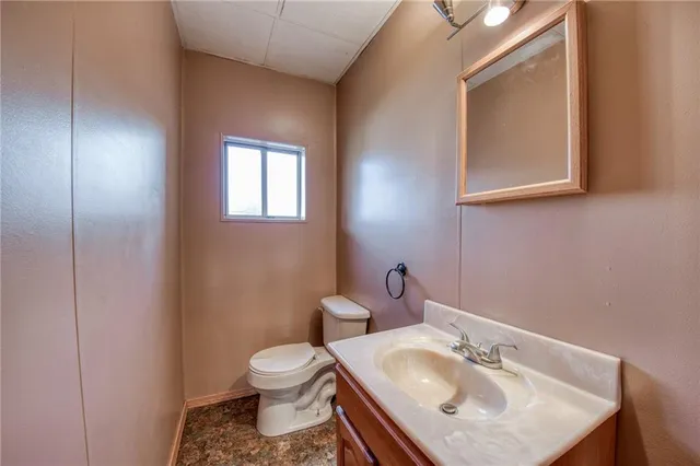 a view of a hallway with wooden floor and entryway