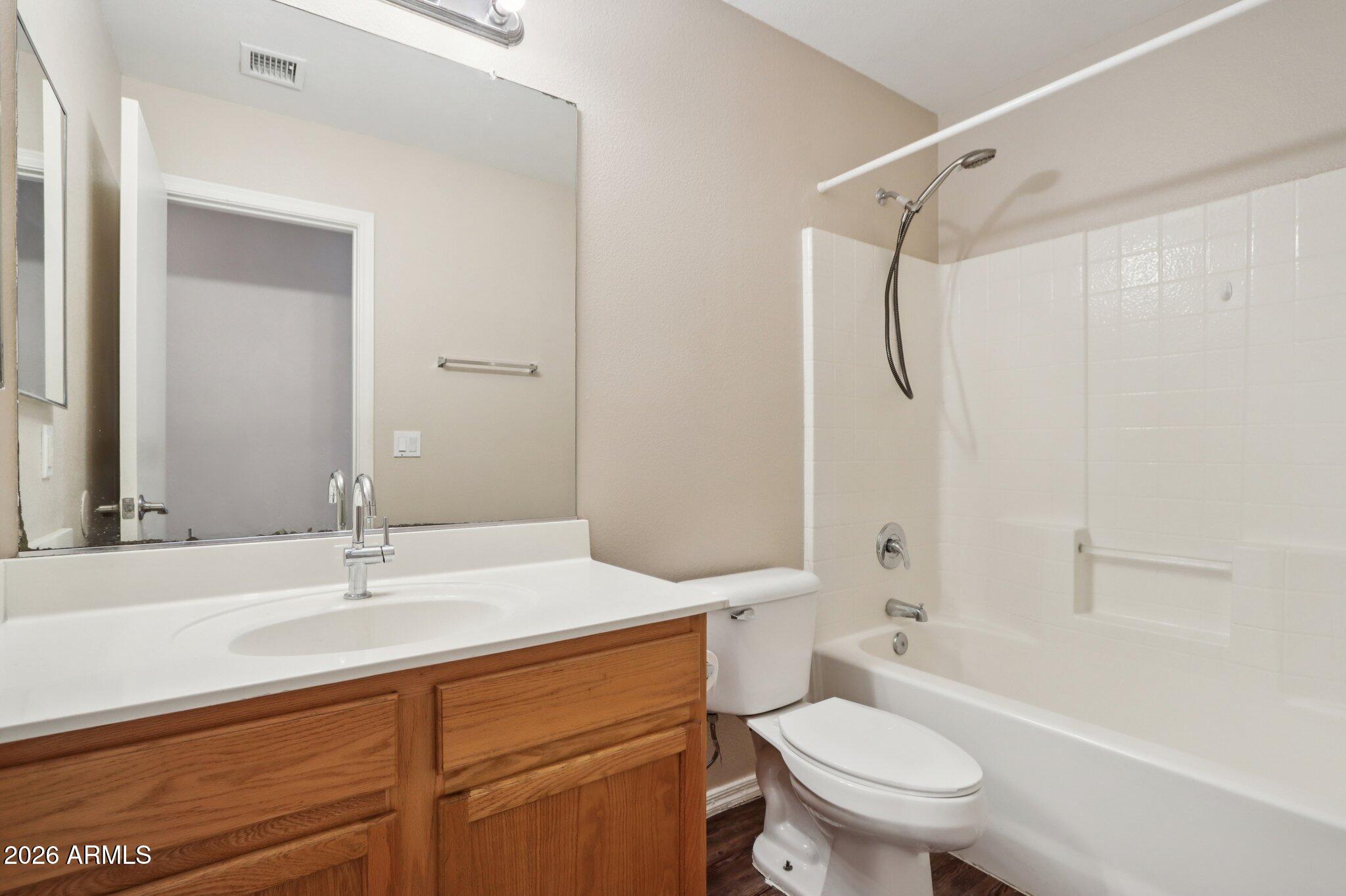 3326 West Shumway Farm Road Phoenix, AZ 85041 - Photo 16 of 30 a bathroom with a sink toilet and shower