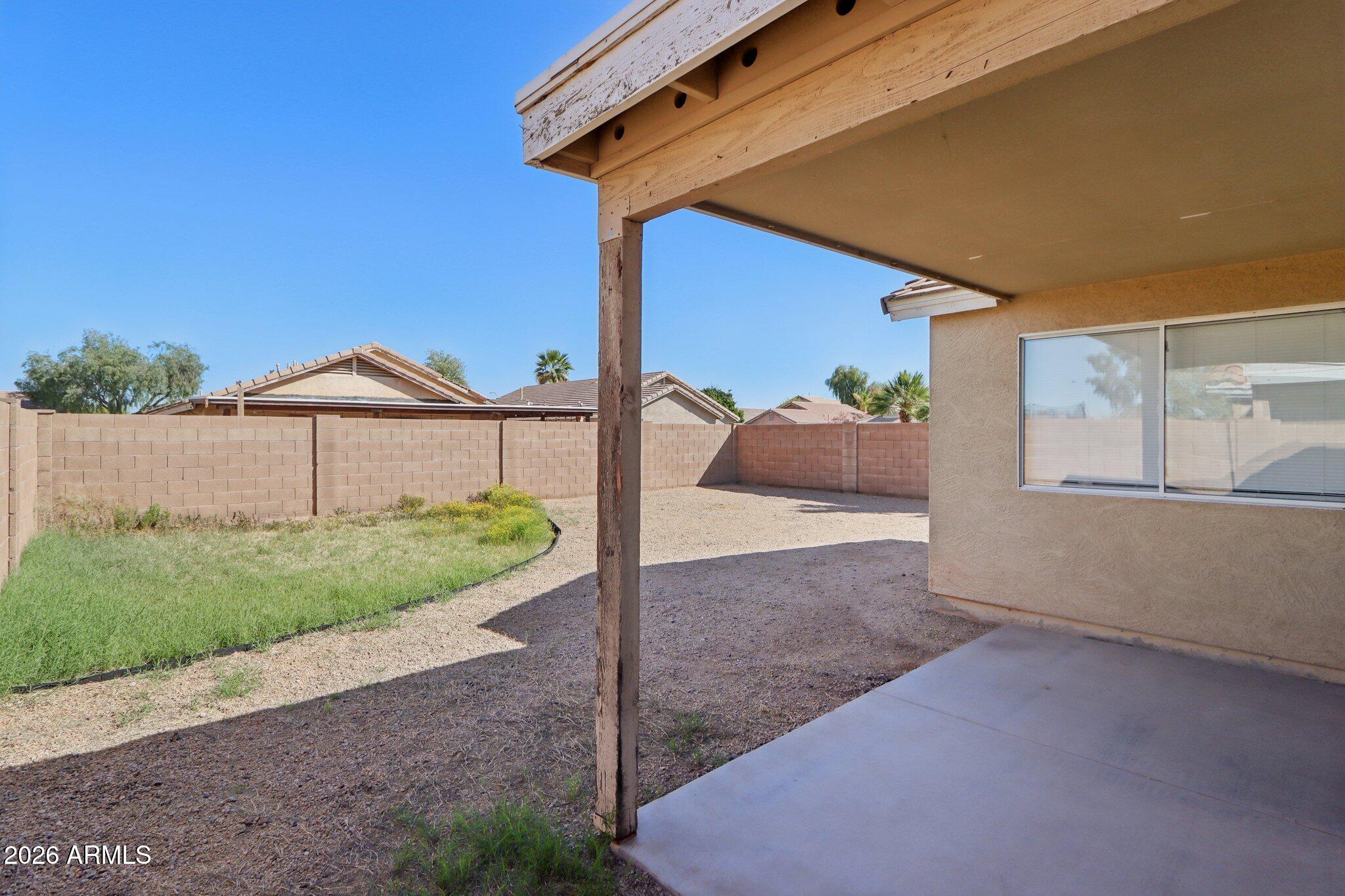 3326 West Shumway Farm Road Phoenix, AZ 85041 - Photo 26 of 30 a front view of a house with a yard and garage
