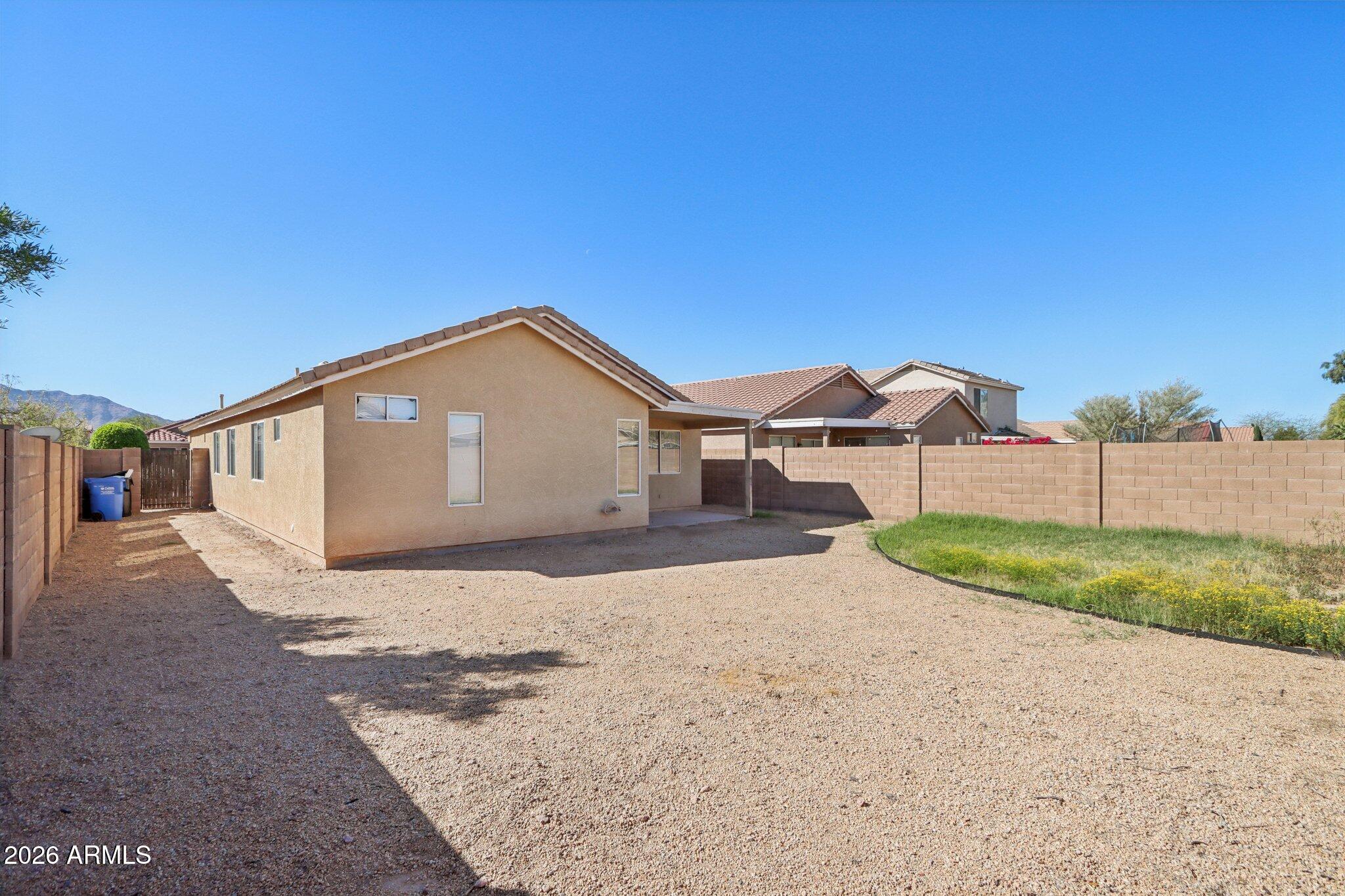 3326 West Shumway Farm Road Phoenix, AZ 85041 - Photo 27 of 30 a front view of a house with a yard