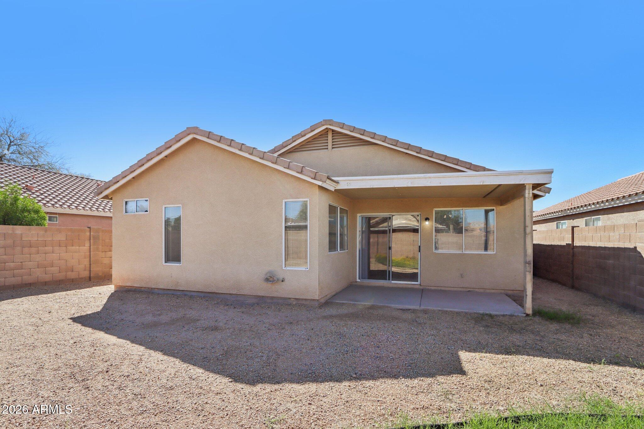 3326 West Shumway Farm Road Phoenix, AZ 85041 - Photo 28 of 30 a front view of a house with a yard