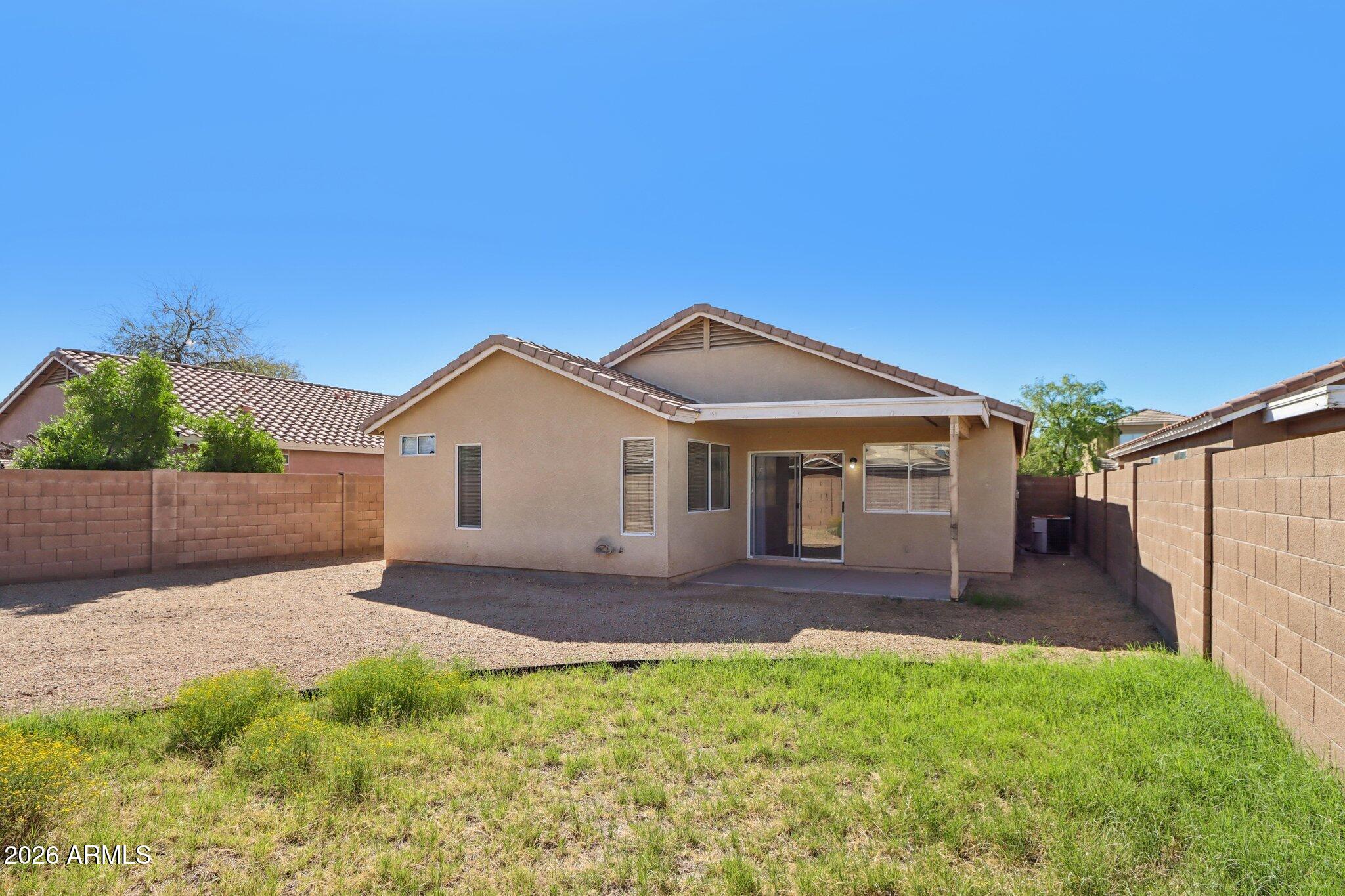 3326 West Shumway Farm Road Phoenix, AZ 85041 - Photo 30 of 30 a front view of a house with a yard and garage