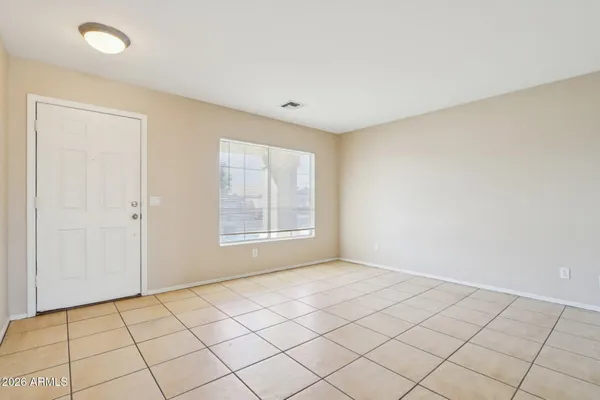 a view of an empty room and window