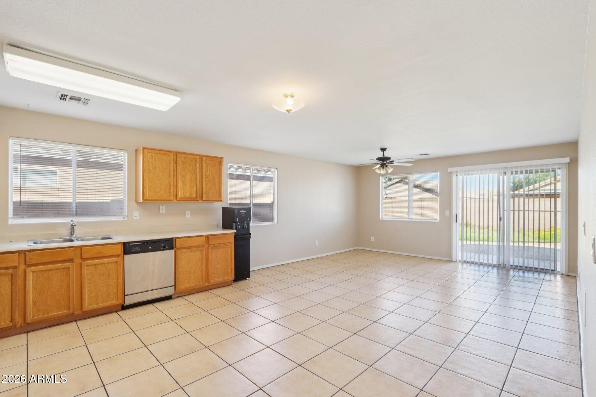 3326 West Shumway Farm Road Phoenix, AZ 85041 - Photo 9 of 30 a large kitchen with a sink and cabinets