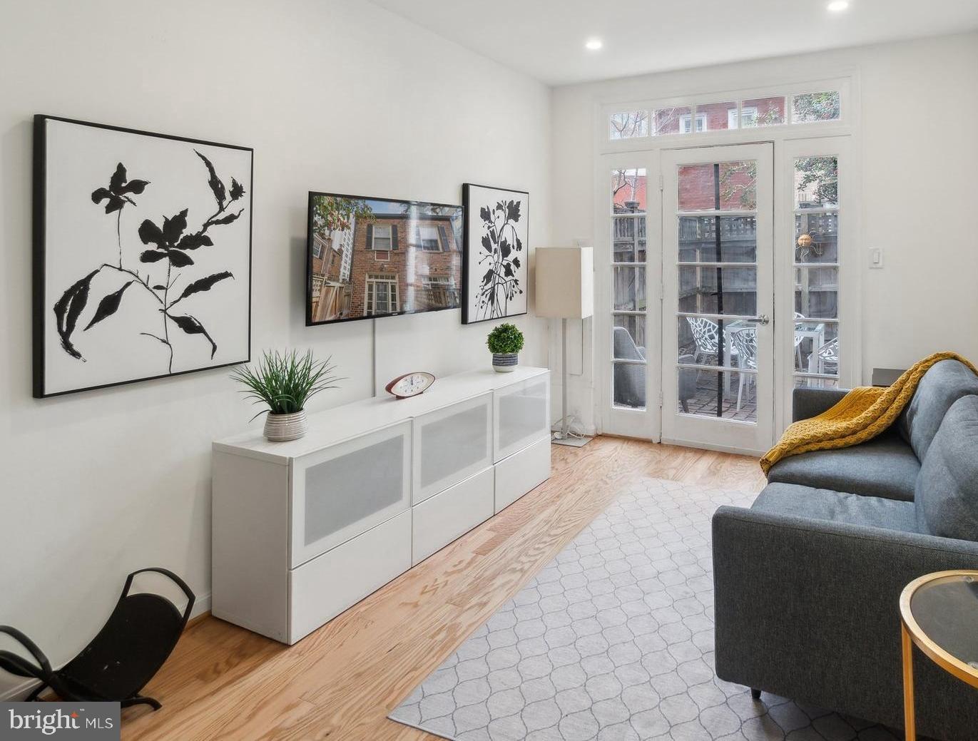 19 Snows Court Northwest Washington, DC 20037 - Photo 1 of 21 a living room with furniture and wooden floor