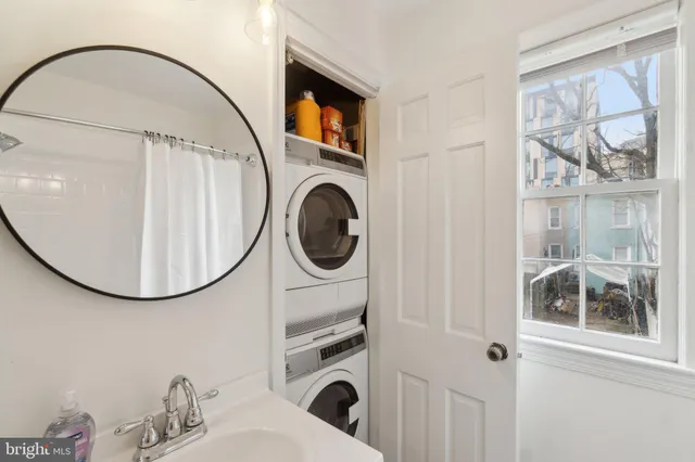 a bathroom with a sink a mirror and a shower