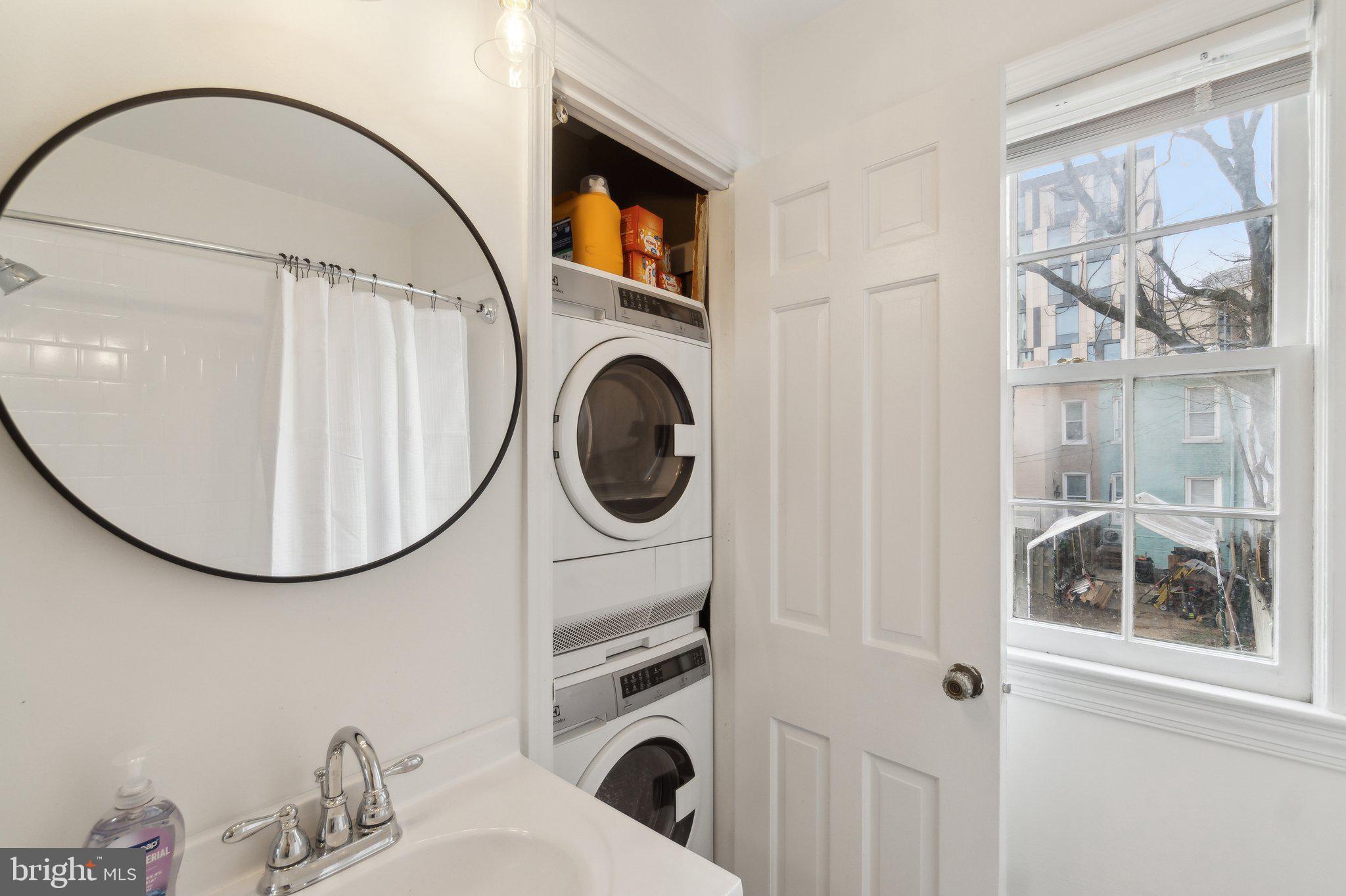 19 Snows Court Northwest Washington, DC 20037 - Photo 13 of 21 a bathroom with a sink a mirror and a shower