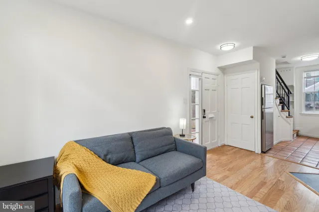 a living room with furniture and a rug