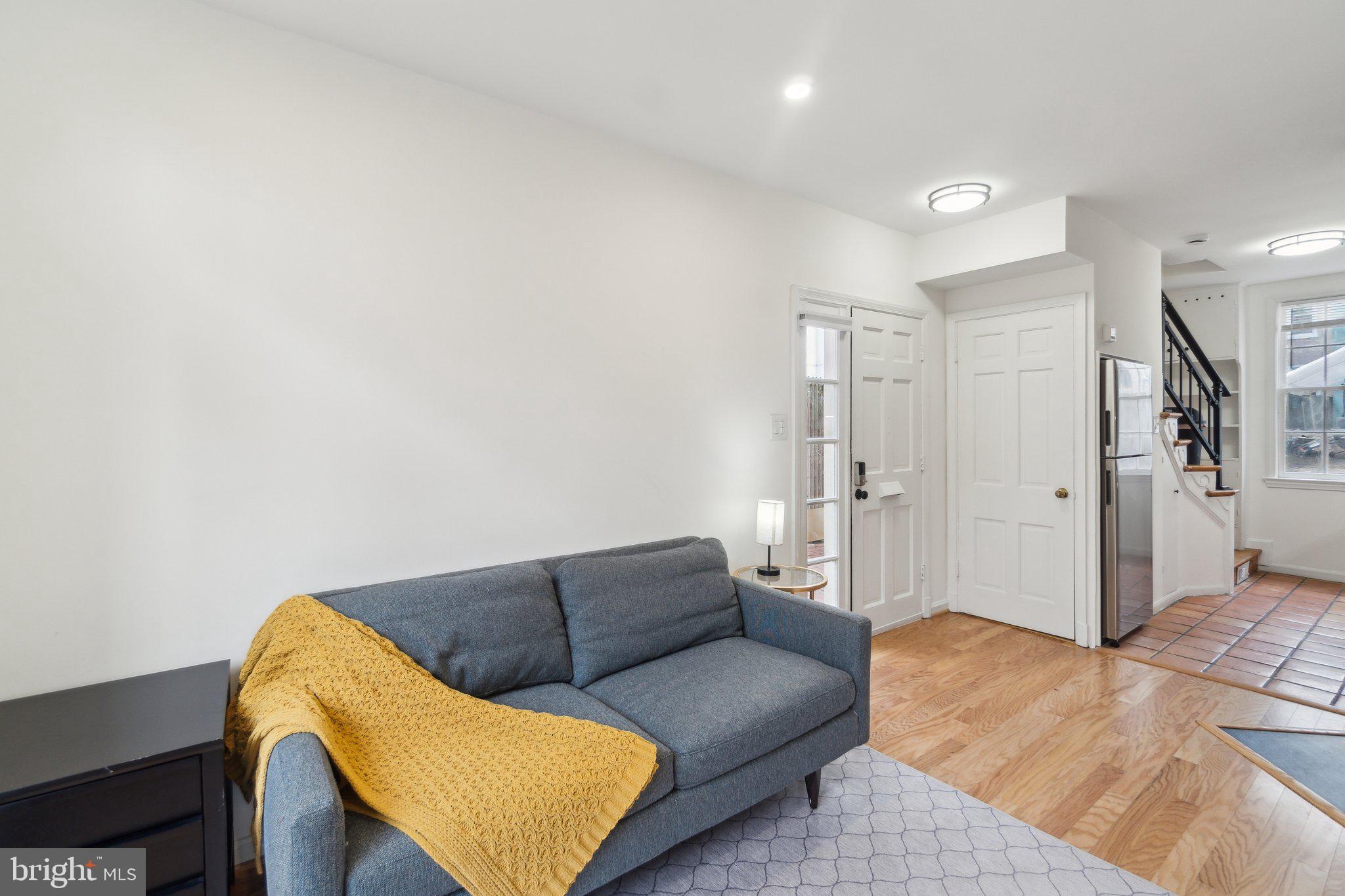 19 Snows Court Northwest Washington, DC 20037 - Photo 6 of 21 a living room with furniture and a rug