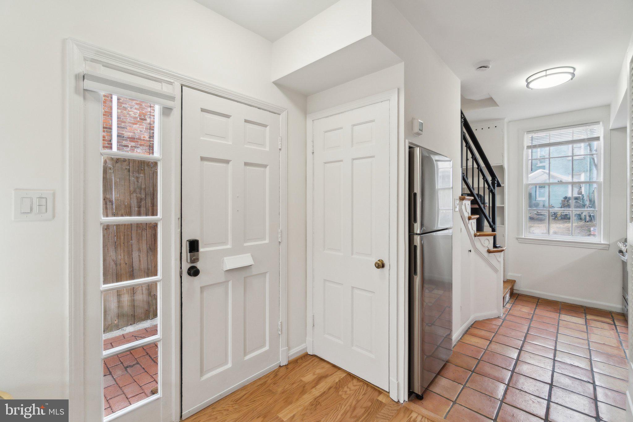19 Snows Court Northwest Washington, DC 20037 - Photo 9 of 21 a view of a hallway with wooden floor and entryway