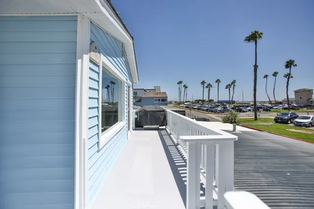 a view of a living room and kitchen with furniture