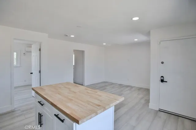 an empty room with wooden floor