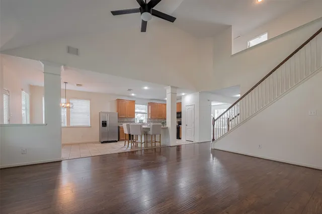 a view of a livingroom with furniture wooden floor and a window