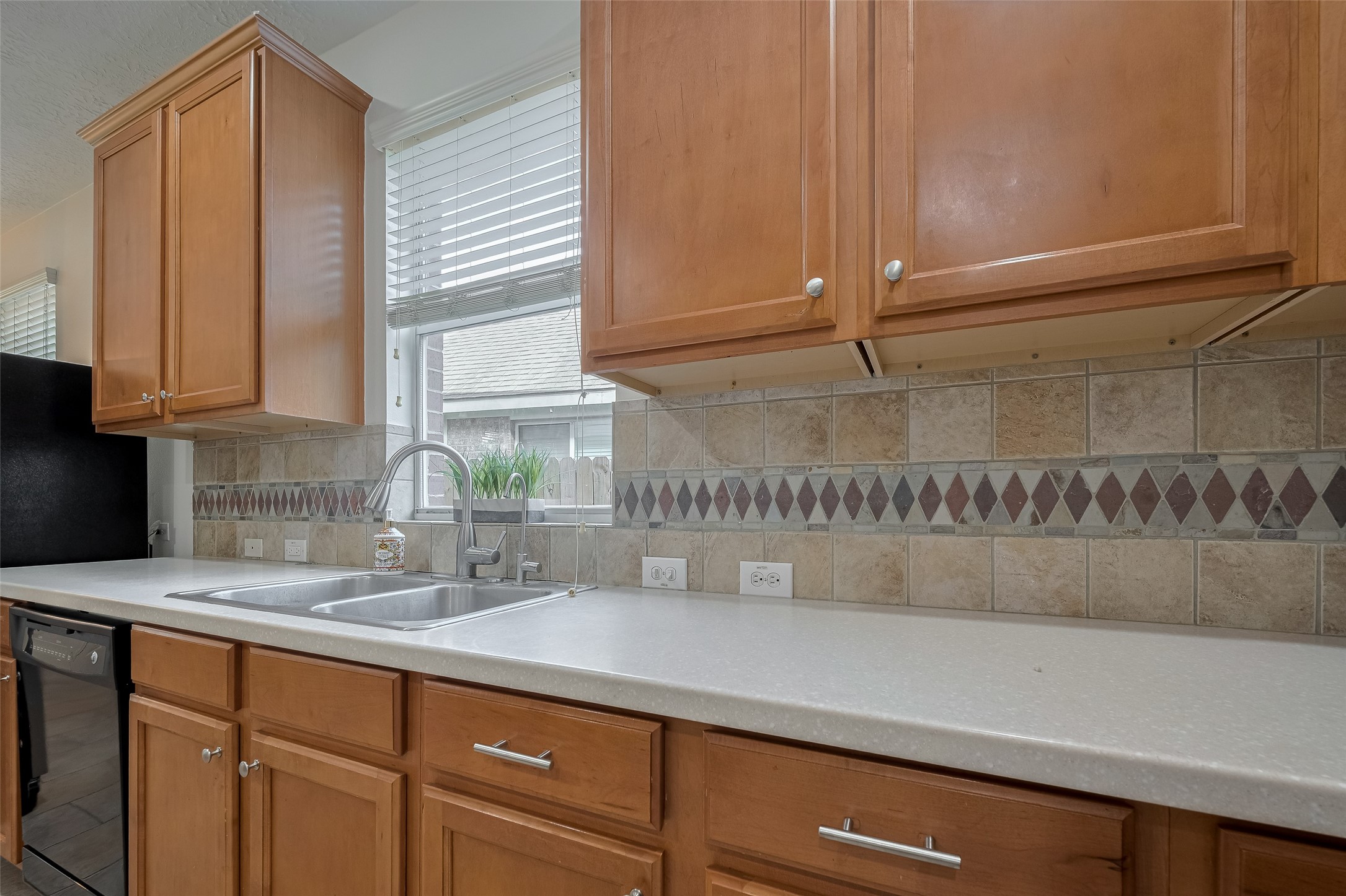 31214 Windcrest Park Lane Spring, TX 77386 - Photo 20 of 45 a kitchen with a sink and cabinets
