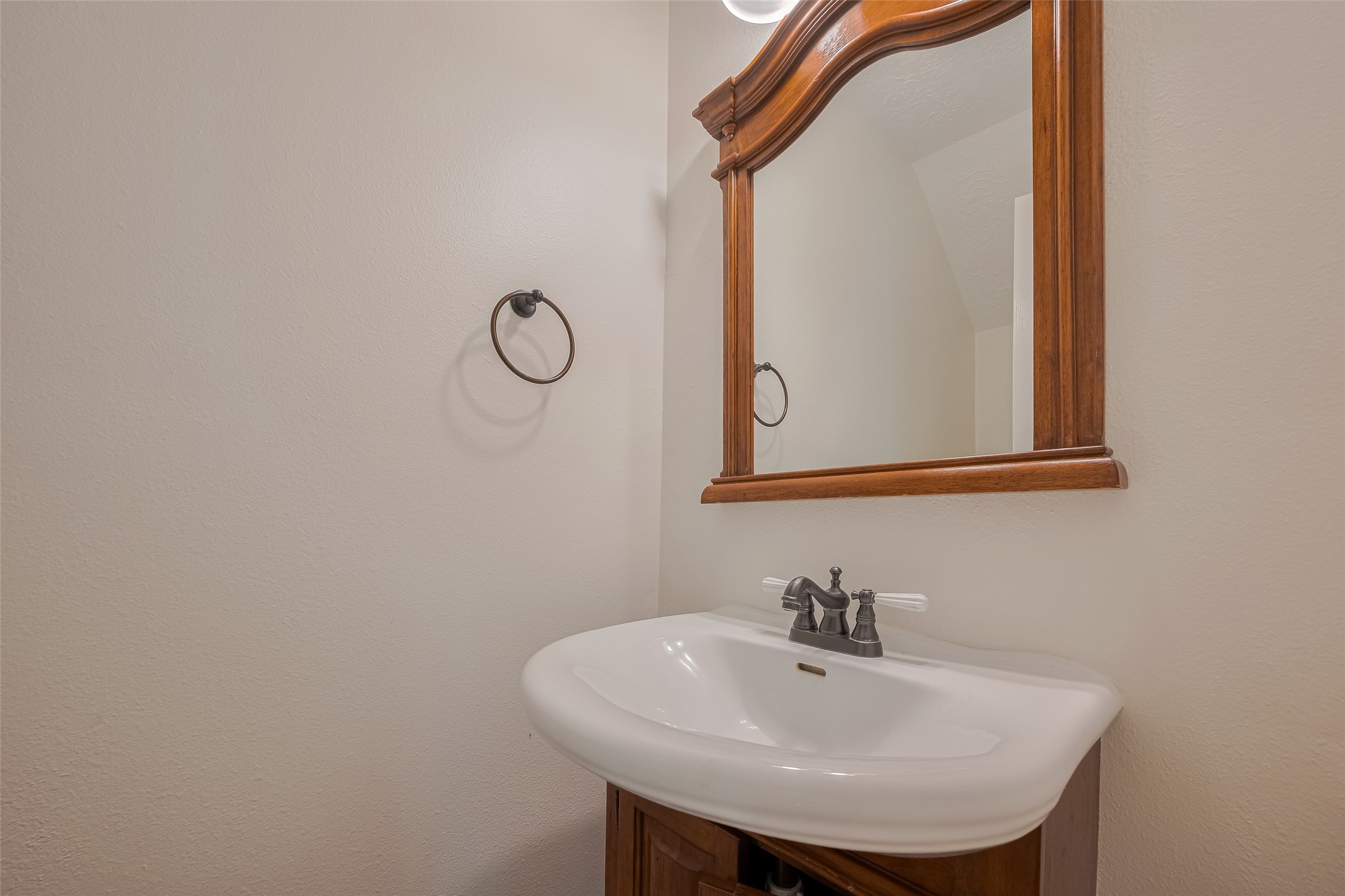 31214 Windcrest Park Lane Spring, TX 77386 - Photo 21 of 45 a bathroom with a sink and a mirror