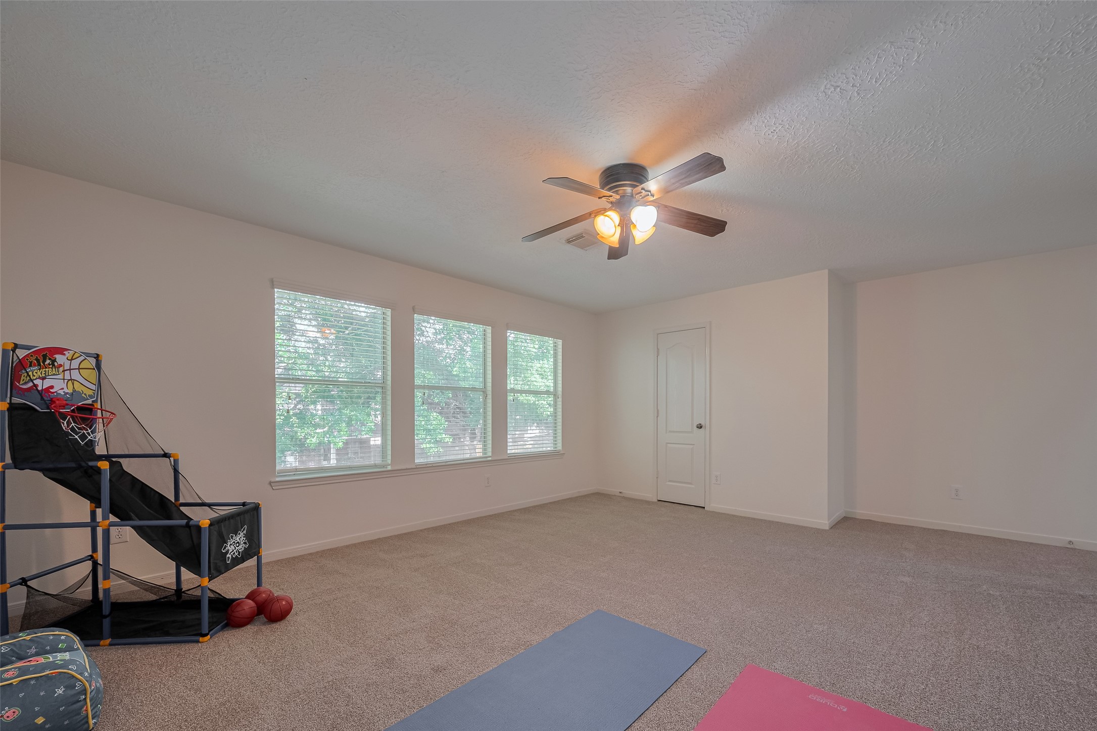 31214 Windcrest Park Lane Spring, TX 77386 - Photo 24 of 45 a view of an empty room with a window
