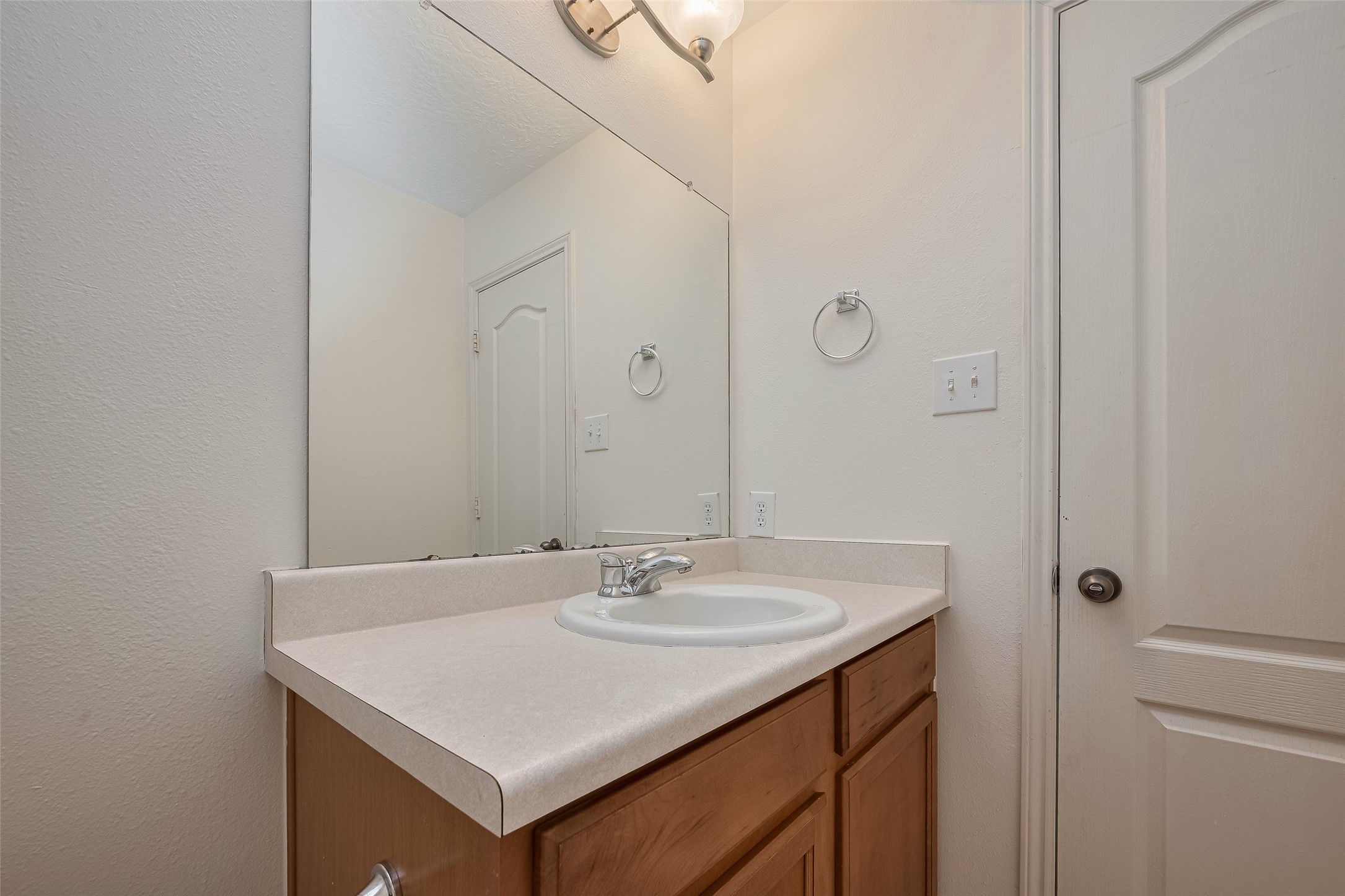 31214 Windcrest Park Lane Spring, TX 77386 - Photo 30 of 45 a bathroom with a sink and a mirror