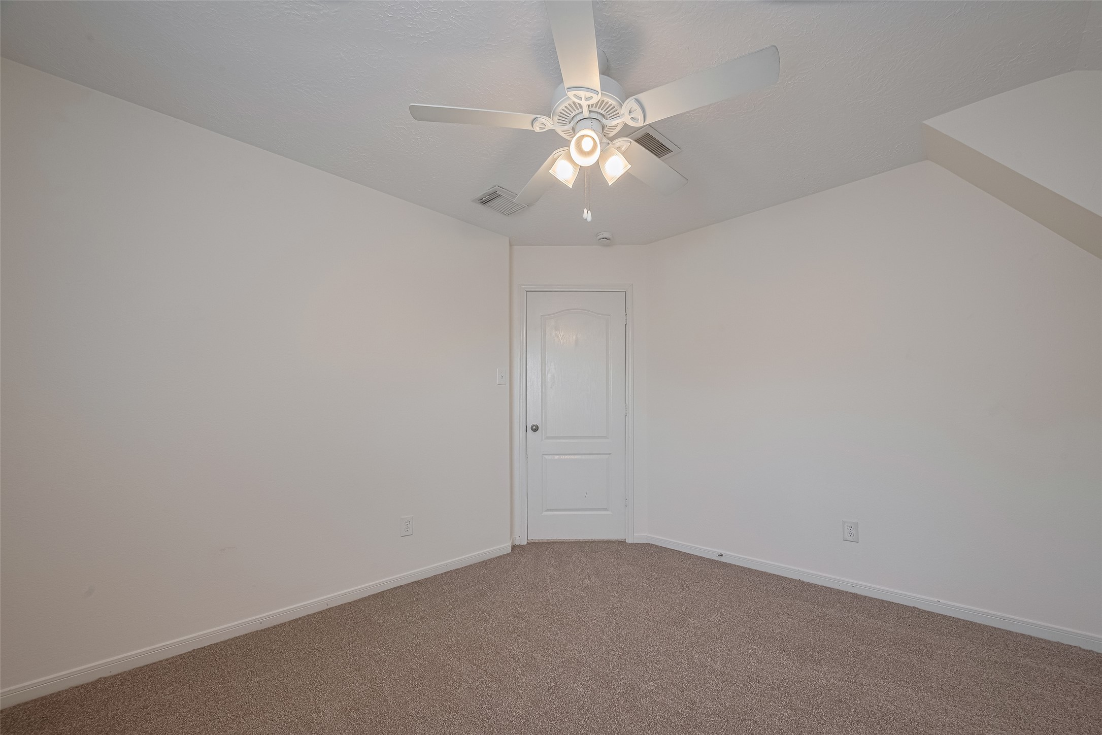 31214 Windcrest Park Lane Spring, TX 77386 - Photo 32 of 45 an empty room with a chandelier fan